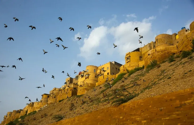 Jaisalmer Fort lit up at night above the city