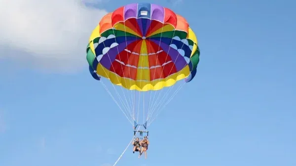 Crew preparing a parasail harness